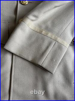 Vintage WWII U. S. Army Air Forces Uniform Jacket with Pins Patches Dog Tags Photo