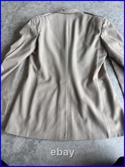 Vintage WWII U. S. Army Air Forces Uniform Jacket with Pins Patches Dog Tags Photo