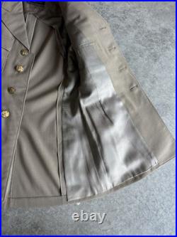 Vintage WWII U. S. Army Air Forces Uniform Jacket with Pins Patches Dog Tags Photo